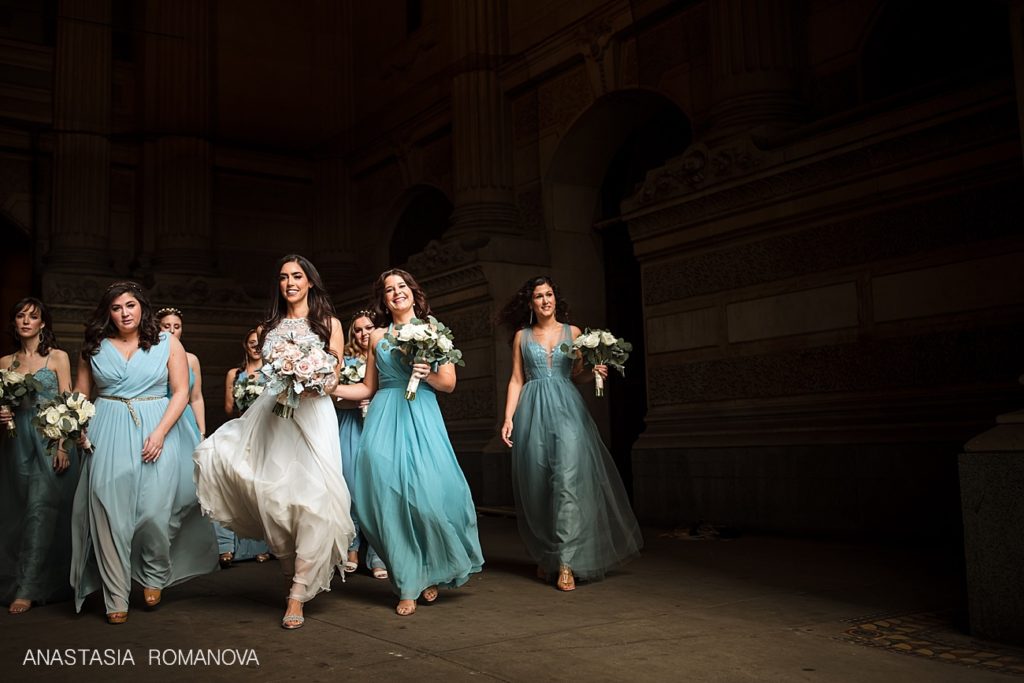 Bridesmaids walking casually with the bride at Philadelphia City Hall
