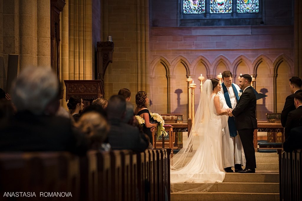bride and groom saying their wedding vows at Bryn Athyn Cathedral ceremony