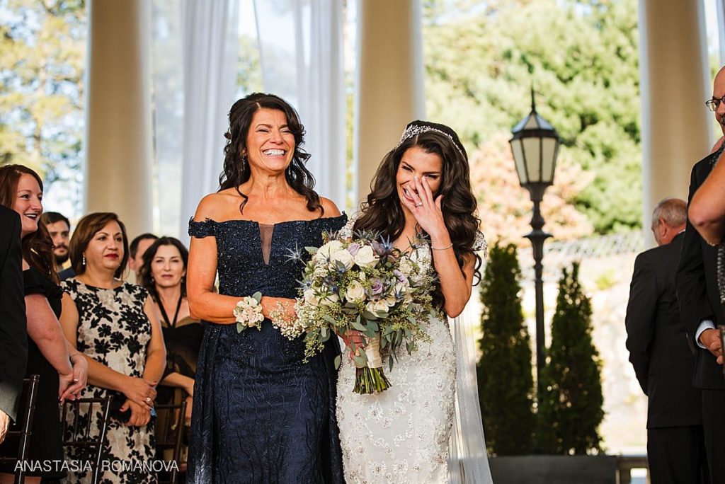 Emotional photo of the bride crying during the wedding ceremony at Water Works