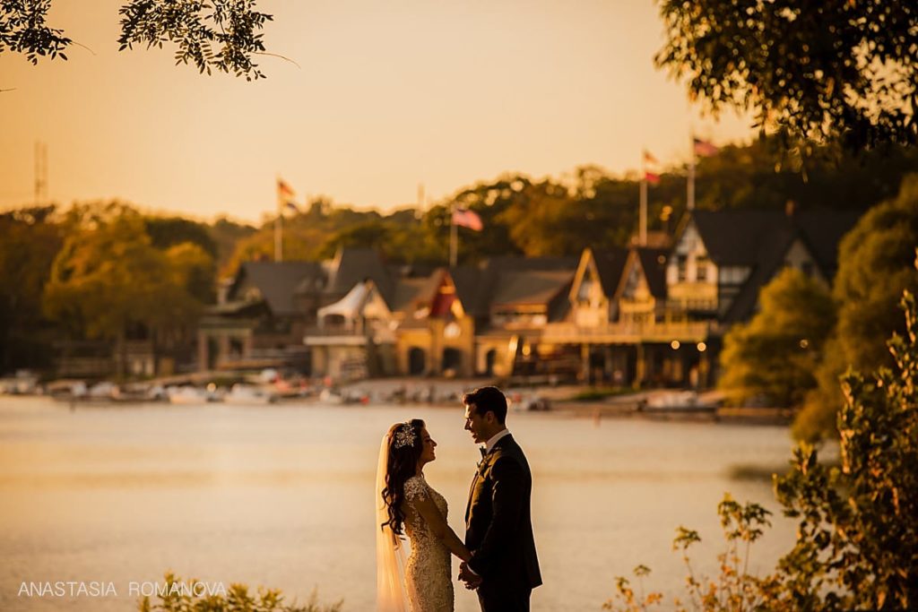 Wedding photo of the couple in front of the Boat House Row