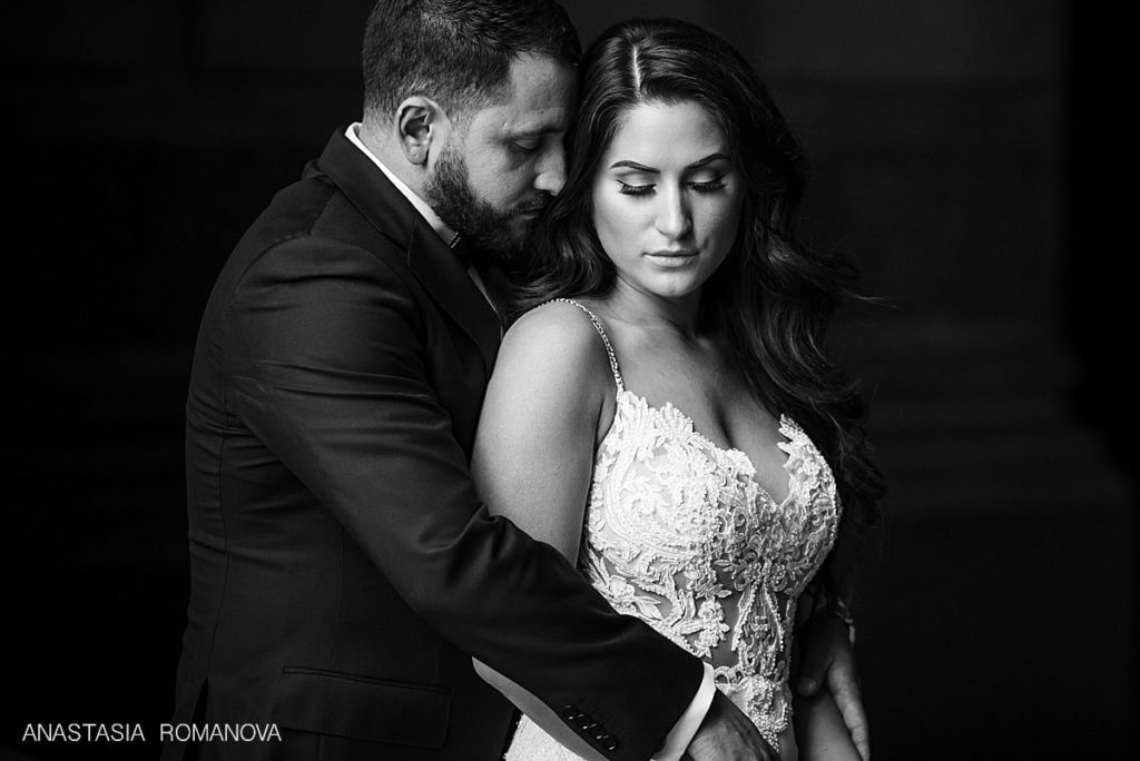Dramatic wedding photo of the bride and groom at Philadelphia City Hall