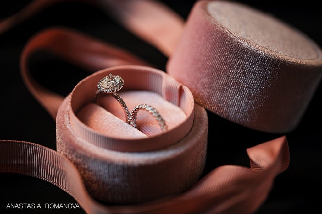 wedding rings in a pick velvet ring box