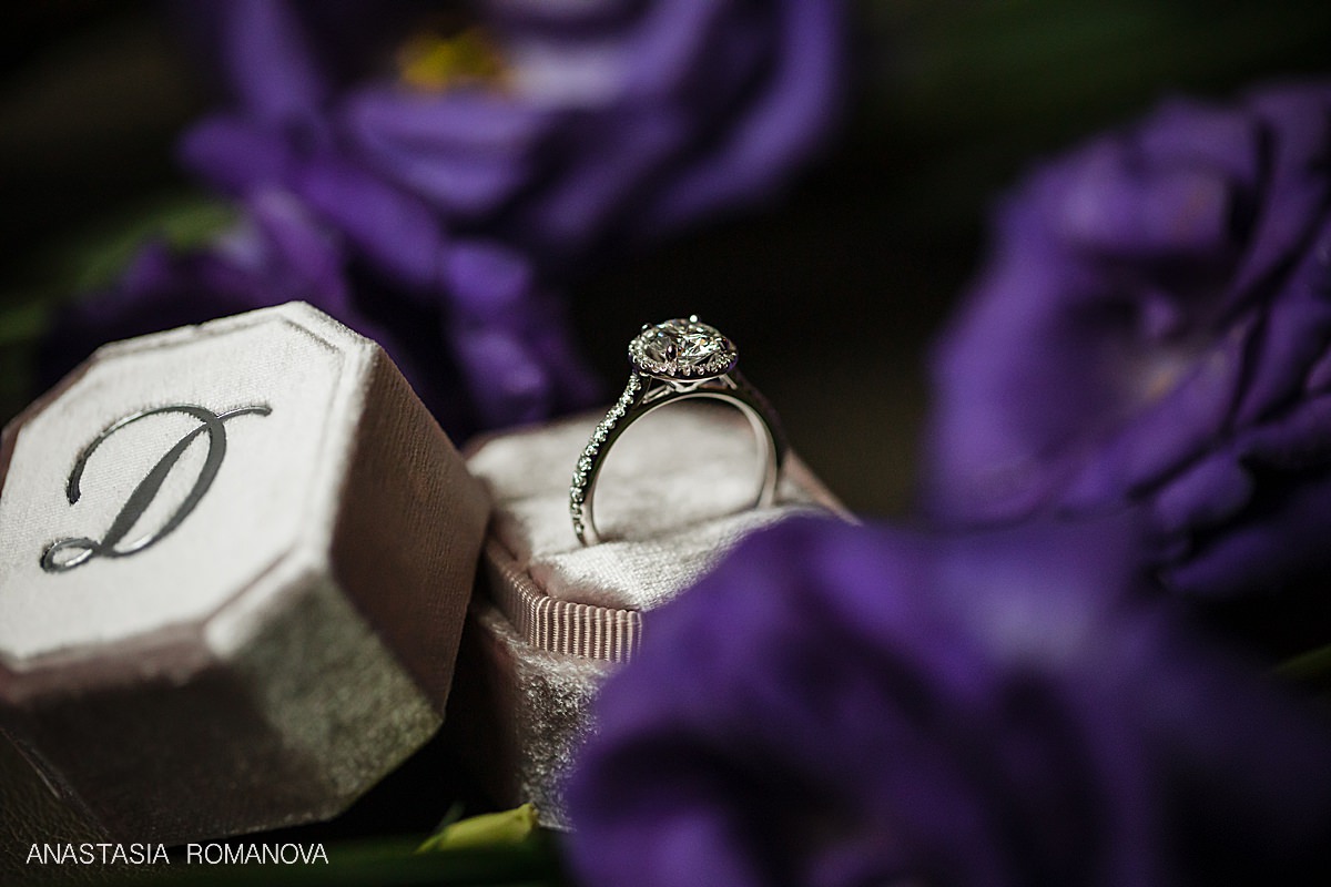 Stunning wedding ring shot in a custom velvet monogram ring box.