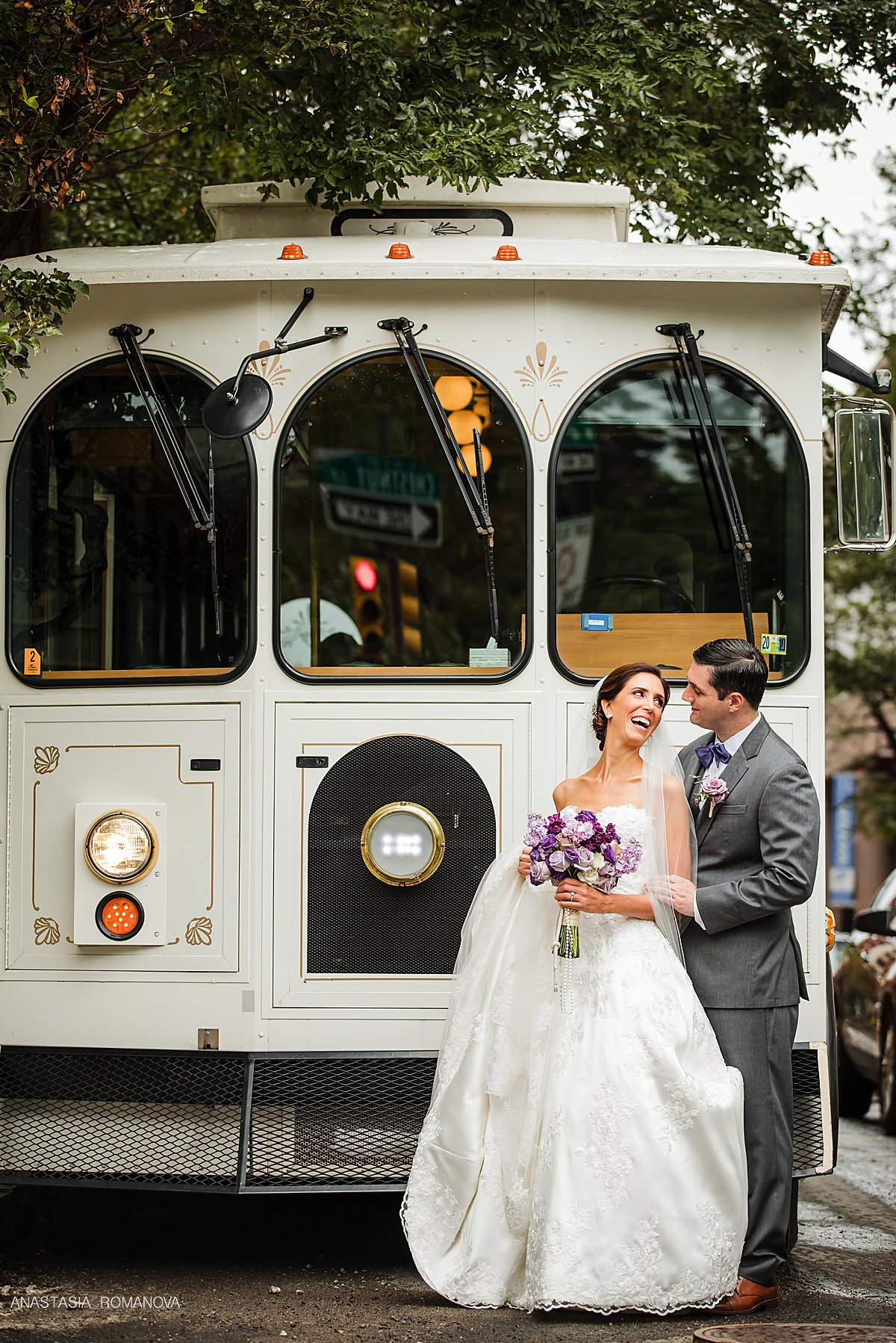 Happy Couple by the limo in Philadelphia wedding