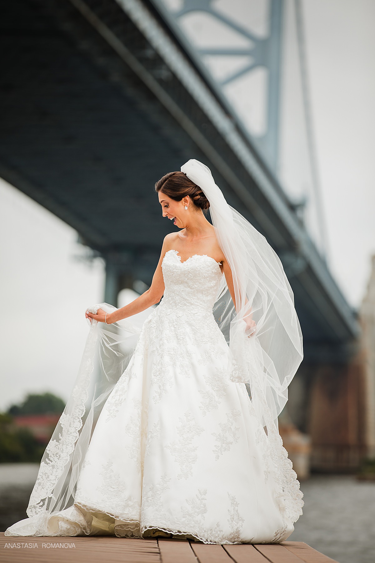 Stunning veil photo of the bride on the Ben Franklin Bridge in Philadlephia