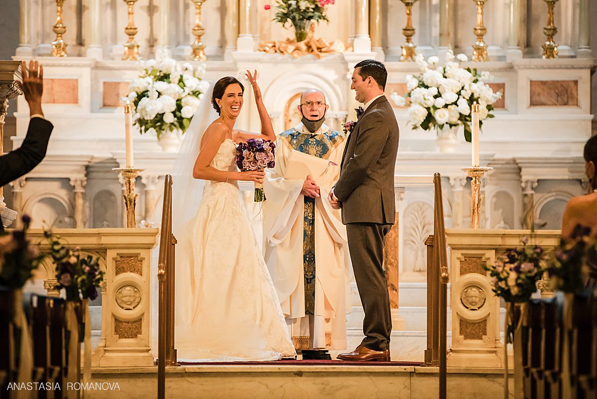 Happy bride smiling at St Augustine church in Philadelphia