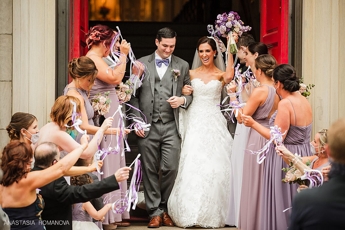 Bride and Groom church exit with ribbons at St Augustine Church in Philadelphia