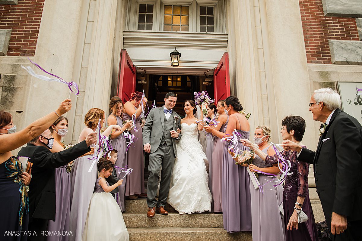 Bride and groom exiting the church after St Augustine Ceremony in Philadelphia